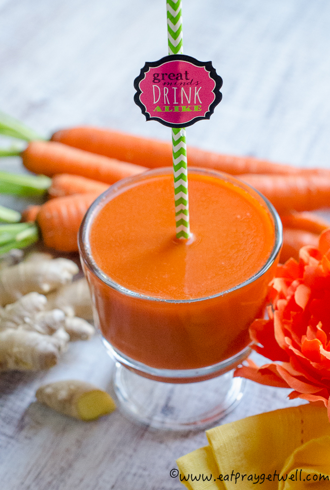 carrot ginger juice with a straw that says great minds drink alike