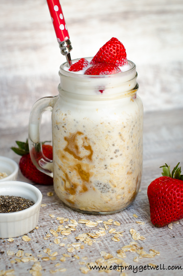 mason jar of overnight oats with a red spoon inside 
