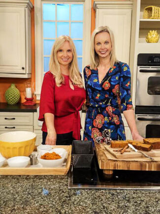 two women on a tv set making pumpkin bread