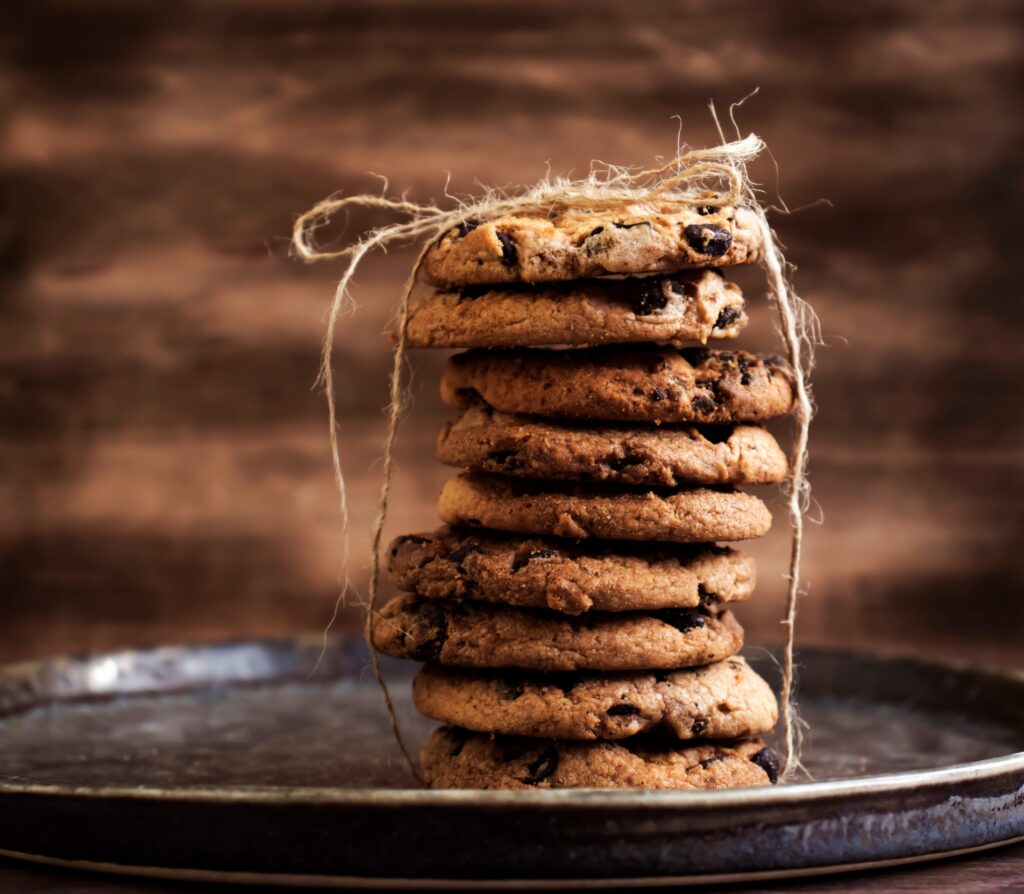 chocolate chunk cookies on a metal plate wrapped in string