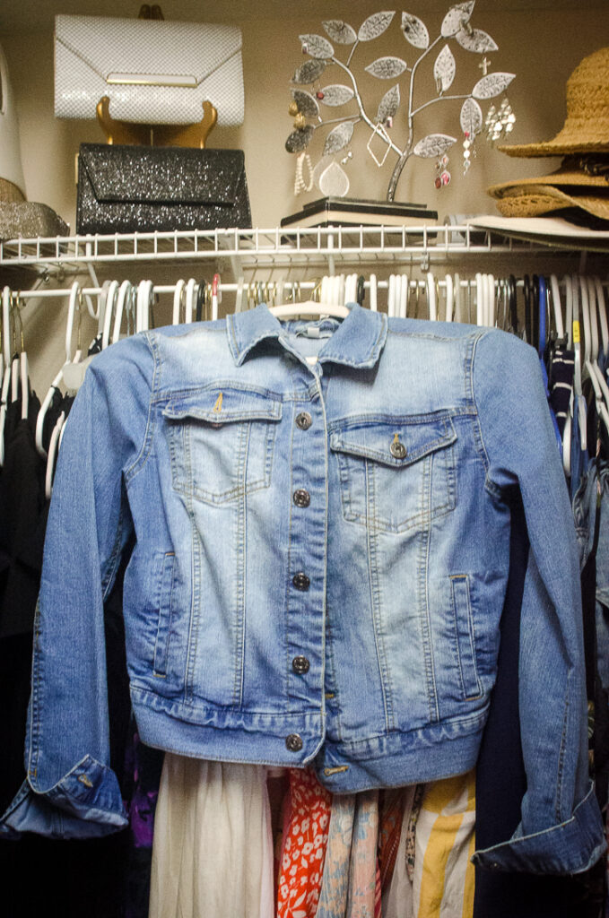 jean jacket hanging in closet